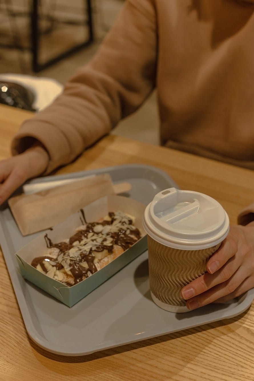 Branded paper trays on a quick-service restaurant tray
