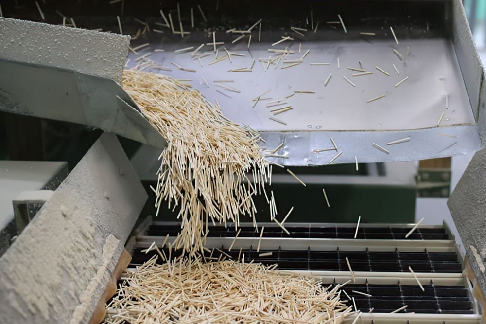 Shredded bagasse fibre being processed